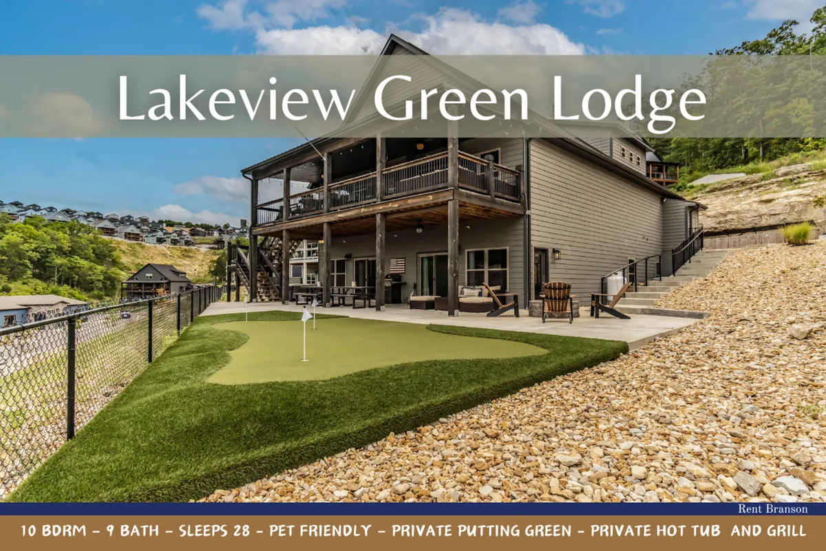 This image displays the heart of the outdoor oasis: a private putting green surrounded by lush landscaping, a bubbling hot tub, a BBQ grill, and a spacious deck seating area—all set against the backdrop of a scenic lake view. The overall setting conveys an inviting space for group activities, relaxation, and enjoying nature.